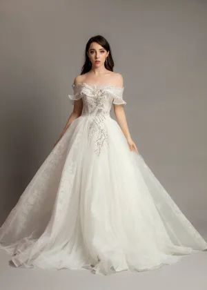 White wedding dress with asymmetrical bustier top and puffy layered skirt